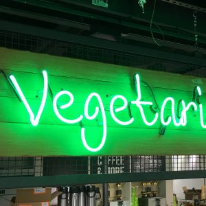 A neon sign that says "vegetarian."