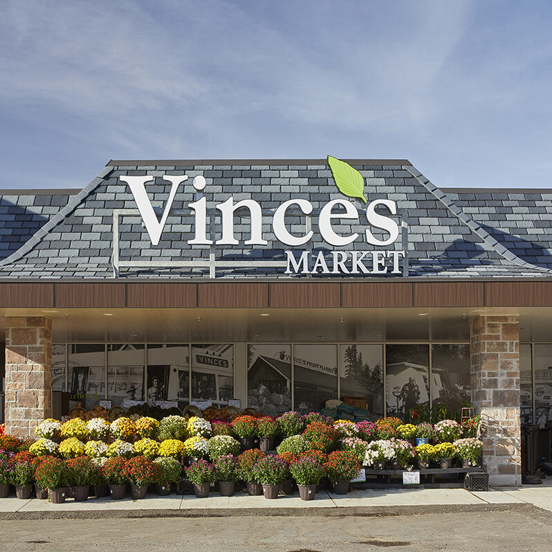 The exterior sign we created Vince's grocery market.