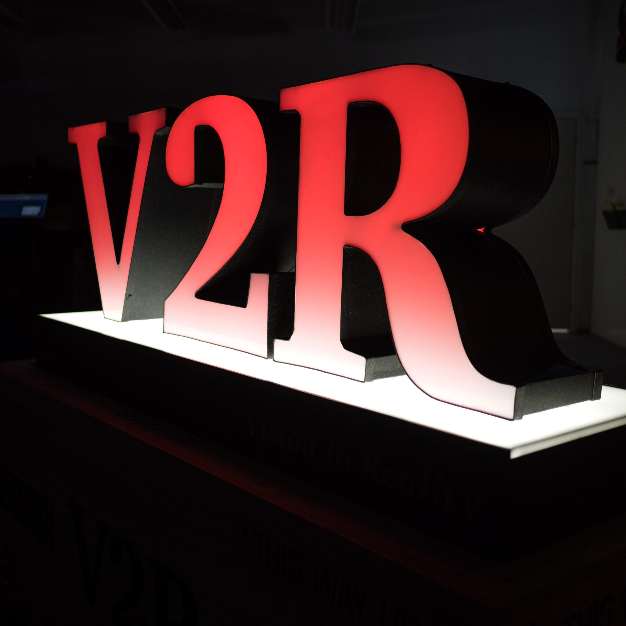 The red 3D channel letters for V2R.